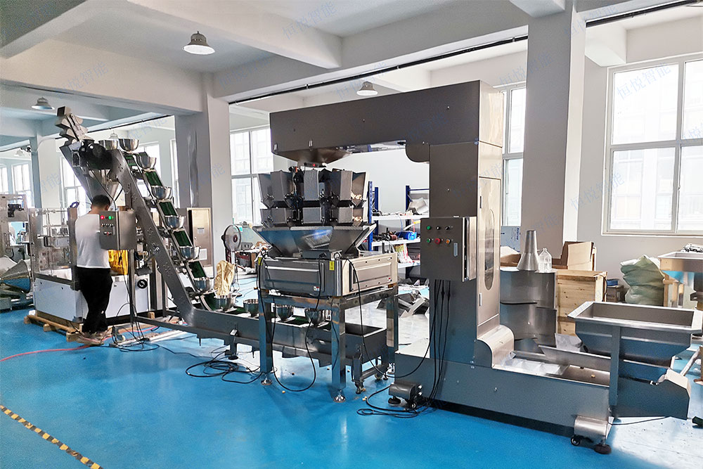 組合秤自動稱重丝瓜视频污污污污是一種集成多鬥組合稱重與自動包裝功能的自動化包裝設備