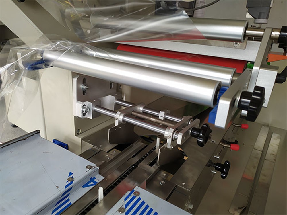 枕式自動丝瓜视频污污污污拉膜機構